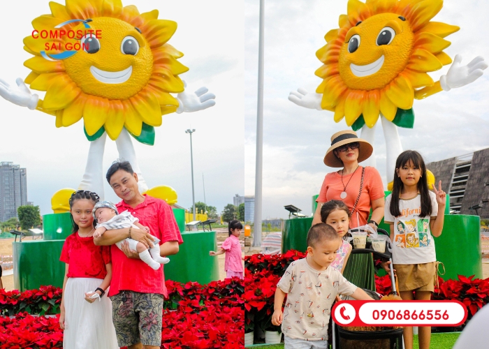 Hình ảnh gia đình chụp hình vui vẻ với mascot hoa tại Công viên bờ sông Sài Gòn